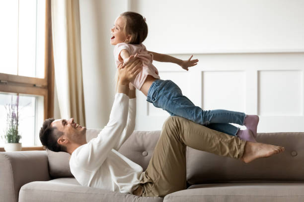 istock Dad and daughter play together at home 1309383543