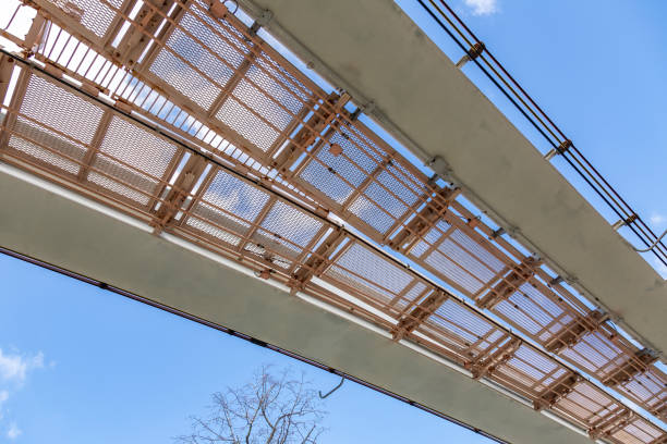 istock Gaze at the cloudy blue sky from under the monorail 1309385942
