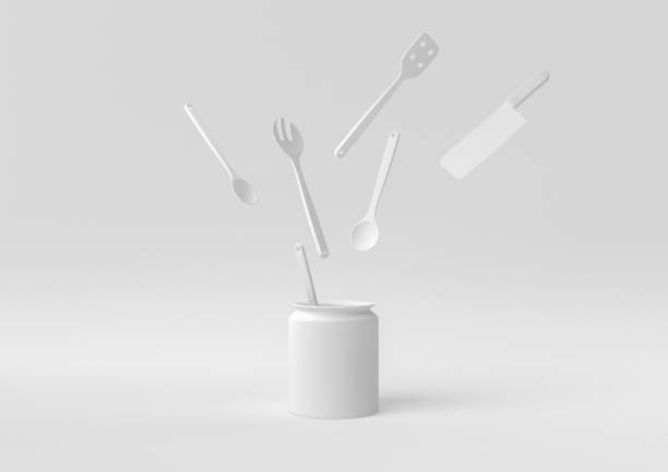 istock White Kitchen utensils and baking ingredients floating in white background. minimal concept idea creative. monochrome. 3D render. 1309387034