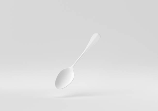 istock White spoon floating in white background. minimal concept idea creative. monochrome. 3D render. 1309387108