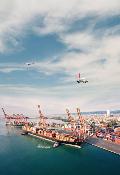 istock Airplane flying over container port 1309389387