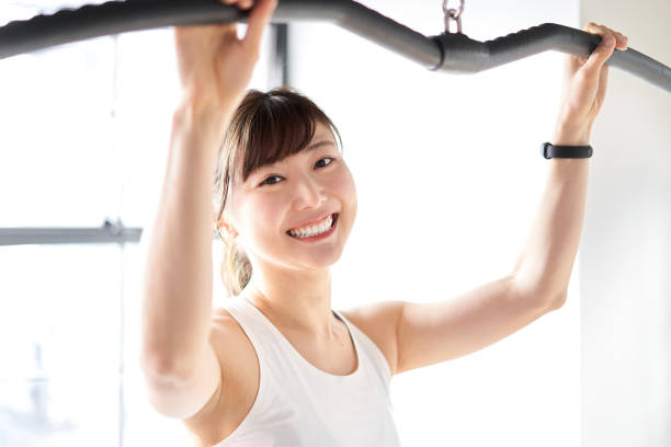 istock Asian woman pulling down a rat with a smile 1309390502