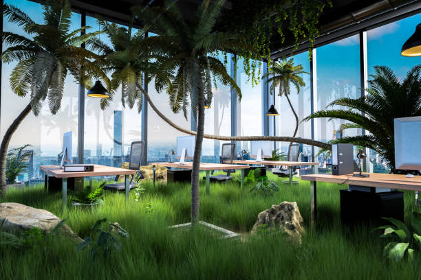 istock workplaces with computers in a modern loft open office overgrown by jungle rainforest plants; panoramic skyline city view; conceptual green sustainable company; 3D Illustration 1309391077