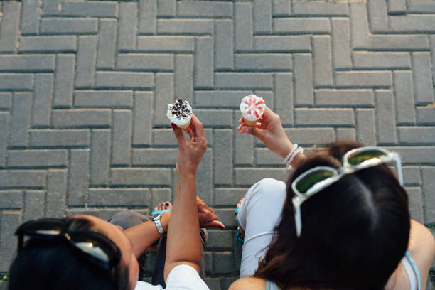 istock Mom And Daughter Eating Ice Cream 1309392233