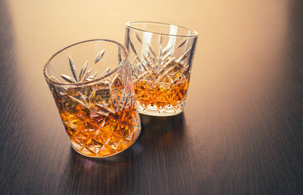 istock alcoholic drink, whiskey in glasses 1309393164