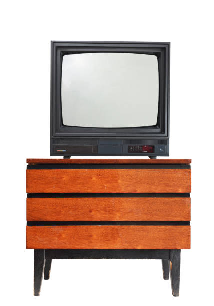 istock An old television set isolated on a white background stands on a vintage bedside table from the 1990s, 1980s. 1309393165