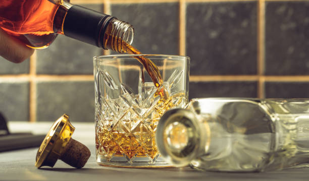 istock whiskey is poured into a glass 1309393191