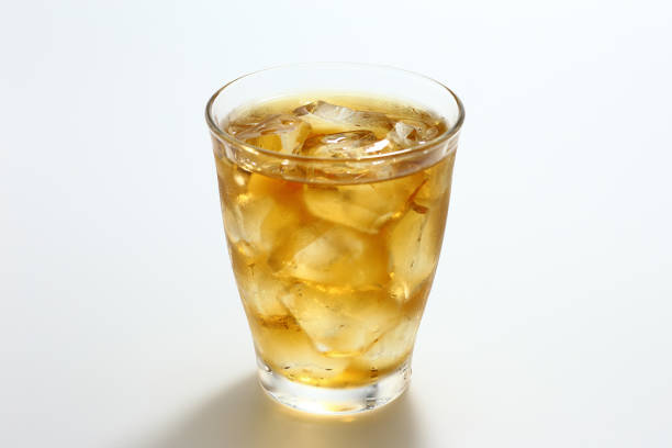 istock Glass of iced tea on white background 1309395390