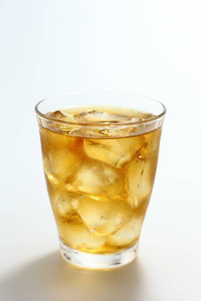 istock Glass of iced tea on white background 1309395392