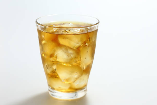 Glass of iced tea on white background