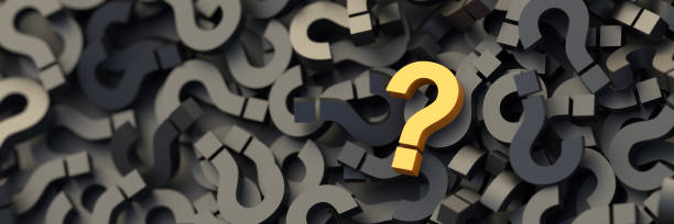 Yellow question mark on a background of black signs, FAQ Concept stock photo