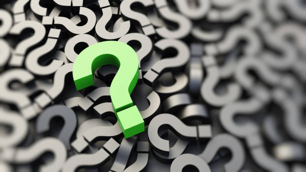 istock Green question mark on a background of black signs 1309397866
