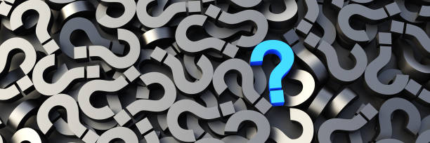 istock Blue question mark on a background of black signs, FAQ Concept 1309397879