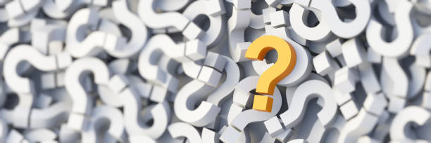 istock Yellow question mark on a background of white signs, FAQ Concept 1309397941
