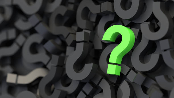 istock Green question mark on a background of black signs, FAQ Concept 1309398743