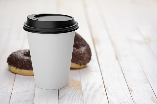 Blank white disposable coffee paper cup with chocolate donuts on white wooden plank tabletop. 3D rendering illustration.