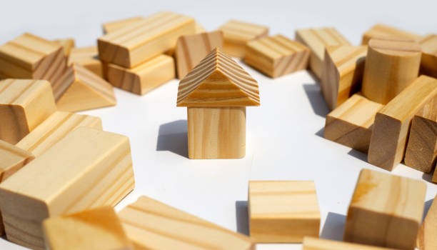 istock Wooden building blocks on white background. 1309403673