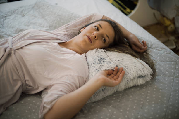 istock Young woman enjoying time in bed 1309404881