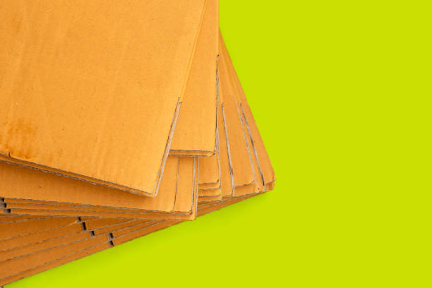 istock Stacking of cardboard boxe on green background. 1309405863