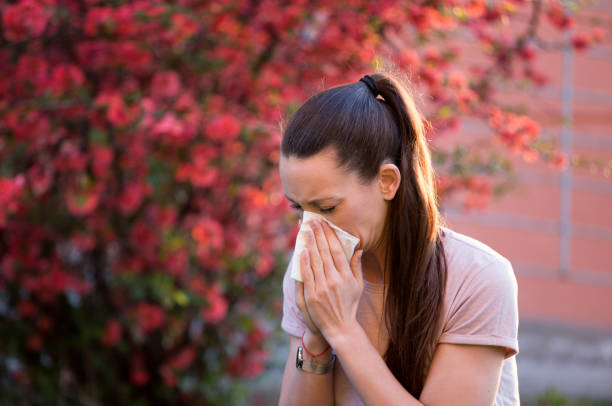 istock Young girl having allergy reaction on blooming tree in spring 1309408185