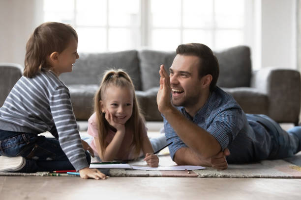 istock Best dad giving high five to happy little kid 1309409444