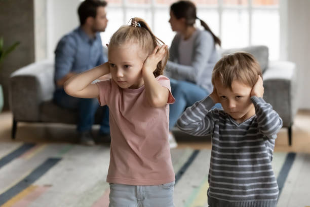 istock Stressed scared little generation Z kids covering ears 1309409480