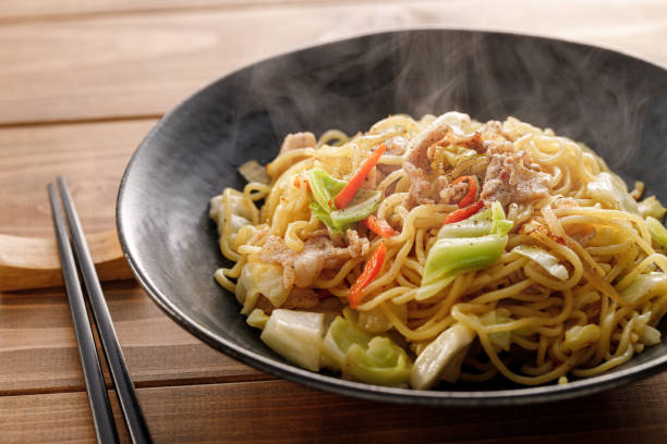 istock Salted fried noodles on a wood grain background 1309410406