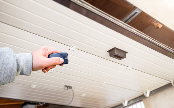 istock Hand use remote controller for closing and opening garage door 1309412733