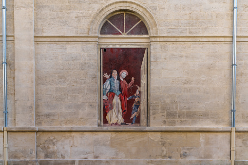 Avignon, France - 18 March, 2021: mural painted on the side of a building in downtown Avignon