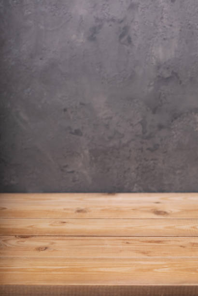 istock Wooden table background and board surface, front view. Wood top table texture 1309414802