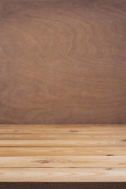 istock Wooden table background and board surface, front view. Wood top table texture 1309414849