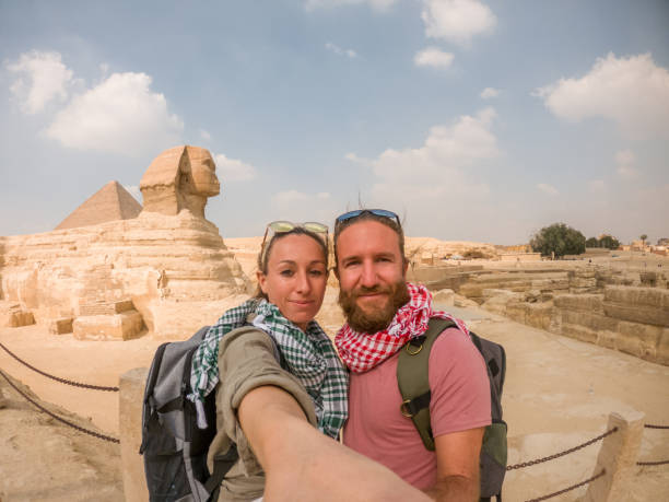 istock Couple take selfie at the pyramids, Egypt 1309416302