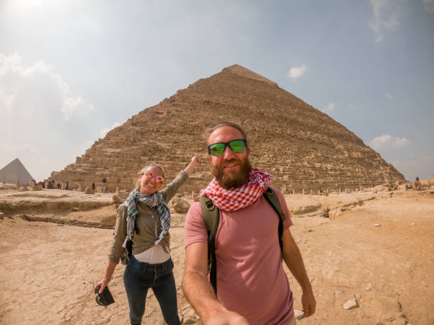 istock Couple take selfie at the pyramids, Egypt 1309416366
