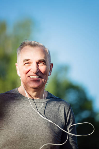 istock Senior seventy years old man jogging at sunrise 1309423592