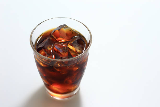 Glass of iced coffee on white background
