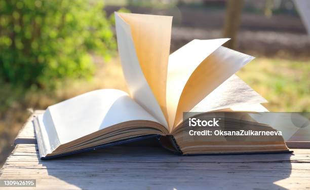 The Book Turns Over Outside Stock Photo - Download Image Now - Page, Turning, Book