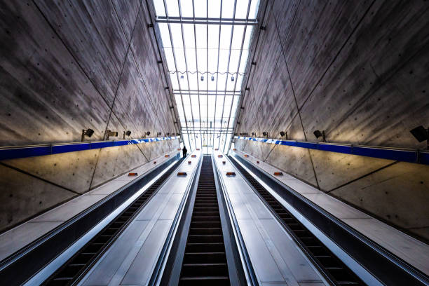 istock People on elevator with futuristic architecture in the city 1309428445