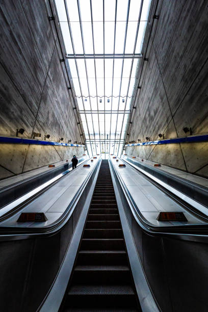 istock People on elevator with futuristic architecture in the city 1309428452