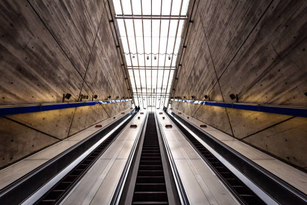 istock People on elevator with futuristic architecture in the city 1309428457