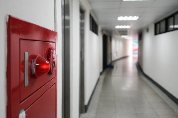 istock Close-up on fire fighting equipment in modern building. The fire hydrant is on the left side of the photo. The shooting location was in a long corridor. 1309429568