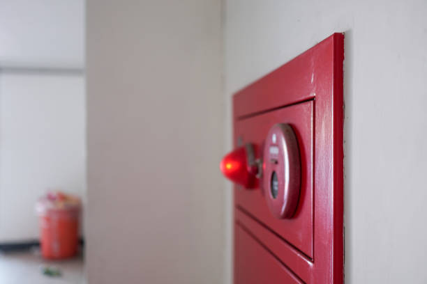 istock Close-up on fire fighting equipment in modern building. The fire hydrant is on the right side of the photo. 1309429680