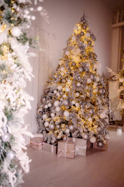 istock Decorated Christmas tree on blurred, sparkling and fairy background 1309430097