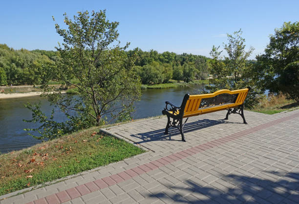 Landscape from a bench on the Tsna embankment Landscape from a bench on the Tsna embankment in Tambov tambov oblast photos stock pictures, royalty-free photos & images