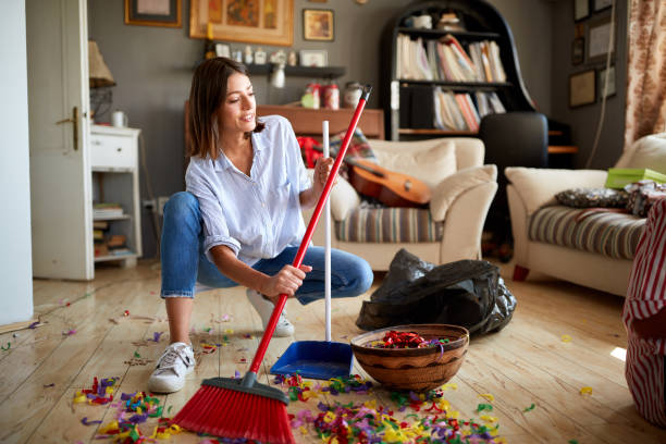 istock Female cleaning after party 1309433533