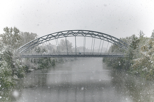Bridge over the river during a blizzard