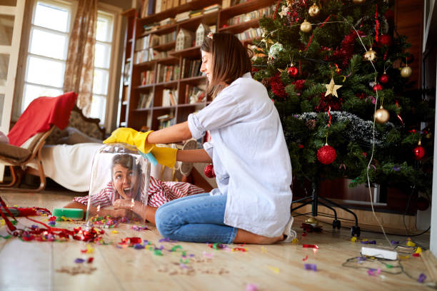 Women having fun while cleaning house