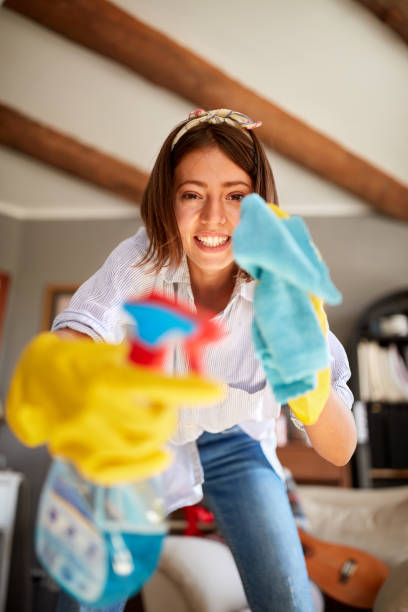 istock Housekeeper cleaning glass 1309435022