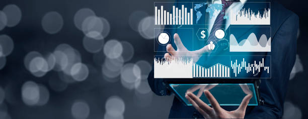 istock Businessman holding tablet with  business graph 1309436053