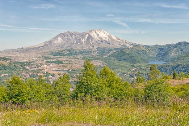 Mount St Helens in the Pacific Northwest erupted in 1980 and turned the surrounding area to Night with ash covering a large portion of the state including the Eastern side, spirit lake next to the site of the volcano filled with trees broken by one of worlds largest slides due to the force of the explosion, now visited annually by thousands where you can view the volcano site and learn its history.