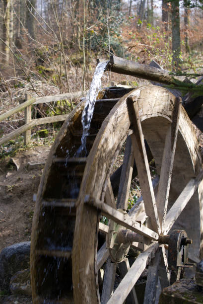 istock Water wheel in the forest at springtime. 1309443746